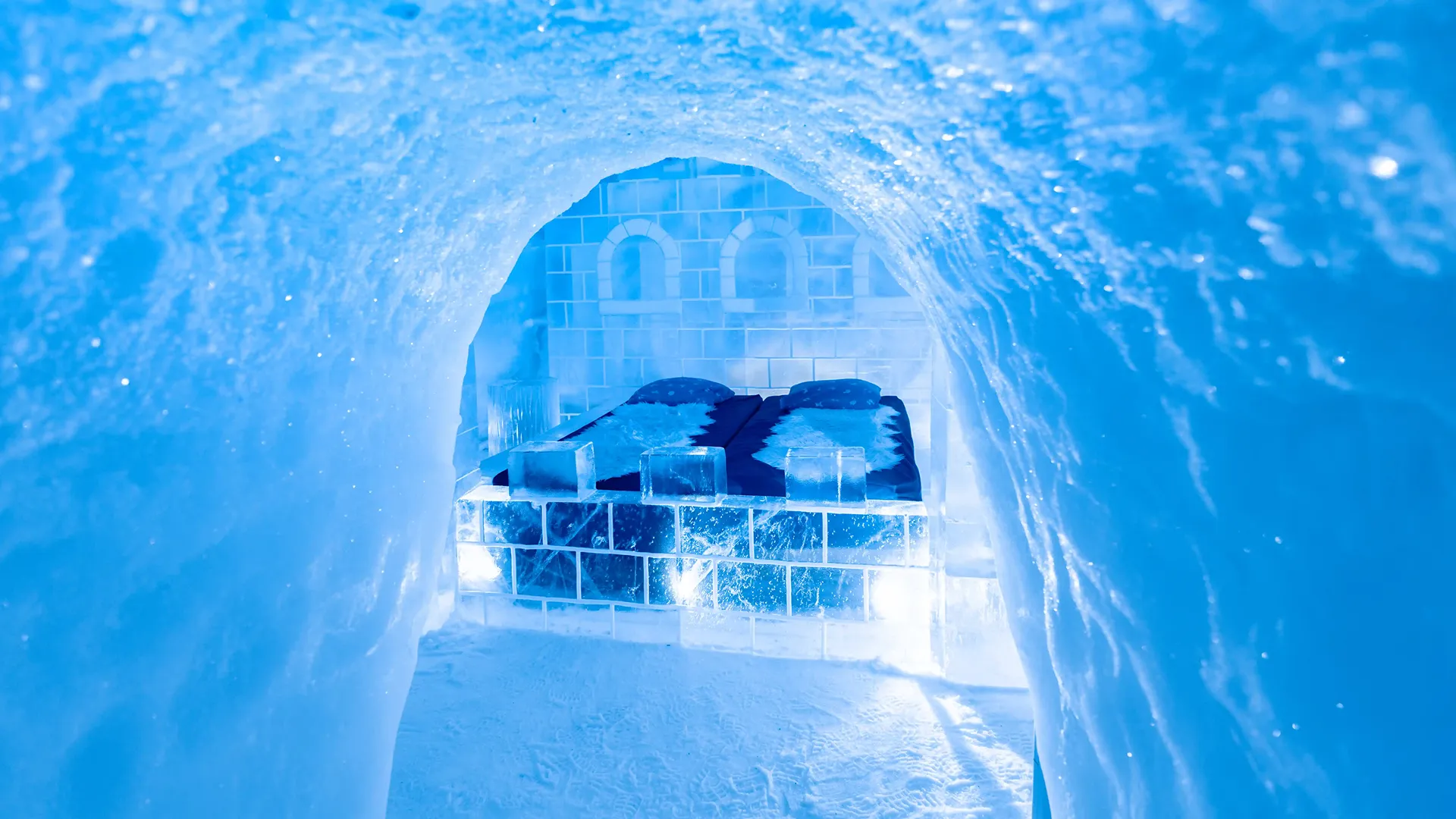 A packed snow wall and sleeping platform inside a snow building - Snowhotel Kirkenes, Kirkenes, Norway